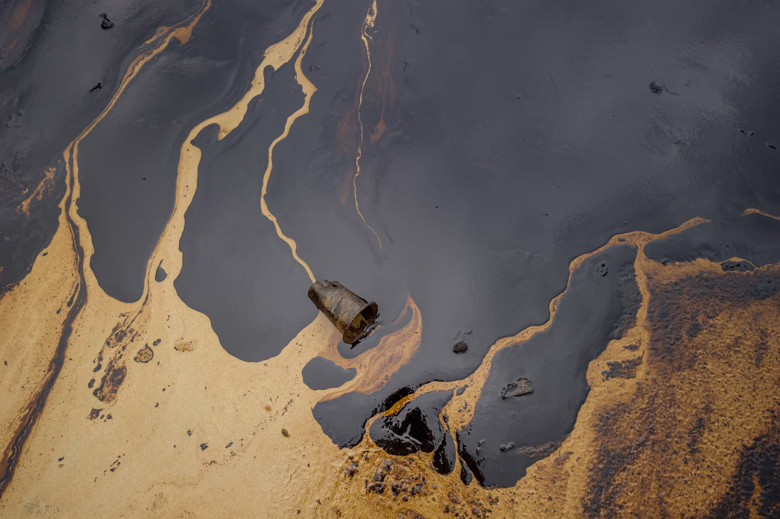 Oil sludge contaminating the sea during the oil spill disaster i
